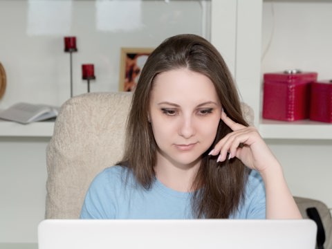 Woman At Screen Thinking